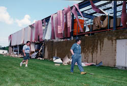 A warehouse is ripped to ribbons by the tornado