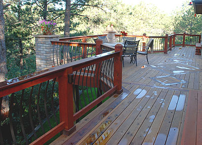 Redwood deck, tigerwood border, brick columns, custom rails