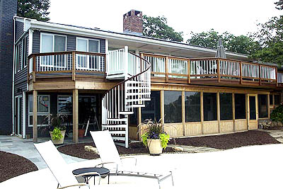 A multi-purpose, two-level Ipe deck with screened porch underneath.
