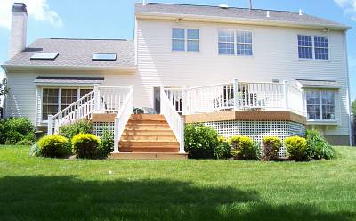 Photo of a Trex Deck with White Vinyl Railings and Lattice