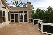 Azek decking with gabled porch with fireplace sideview