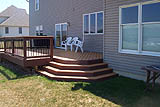 Custom built wrap around steps from deck pic